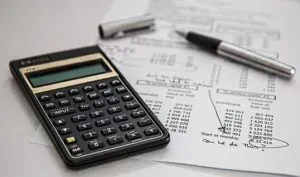 Calculator and pen on documents