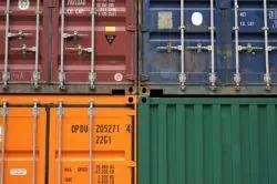 Stacked colorful shipping containers, no readable branding