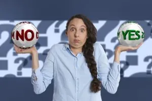 Woman holding YES and NO balls