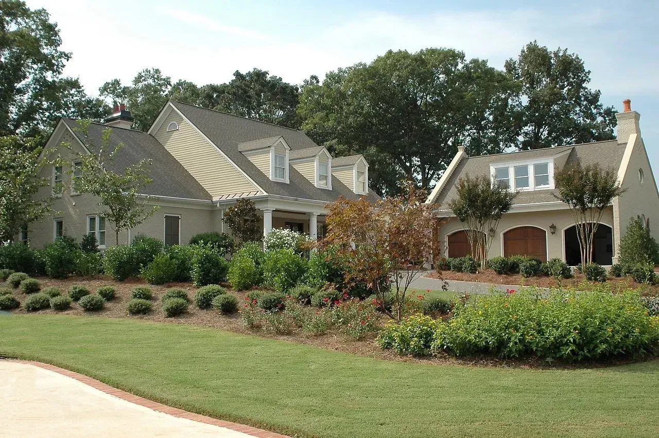 Suburban house with manicured lawn and garden