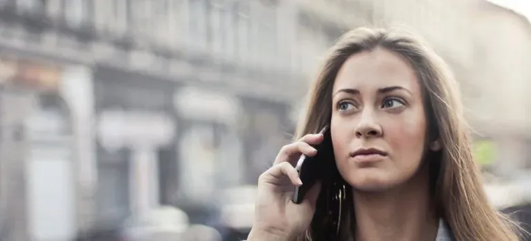 Woman on phone in city street