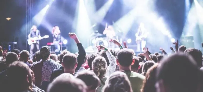 Concert crowd facing stage lights