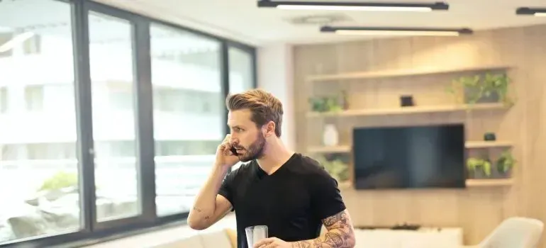 Man talking on phone in modern living room