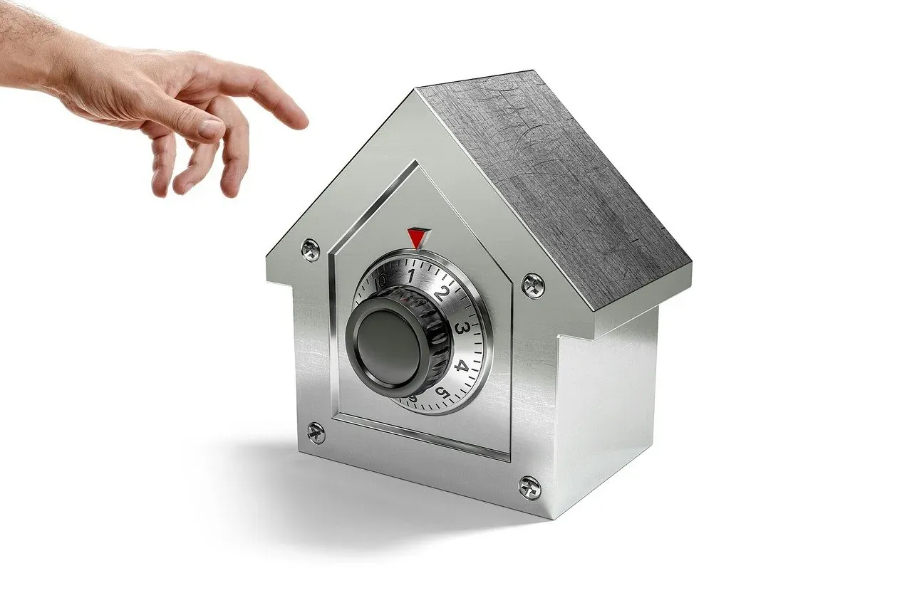 House-shaped safe with combination dial