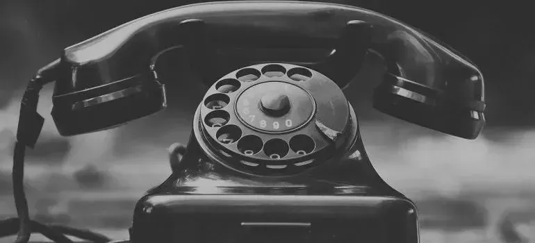 Vintage black rotary telephone in black and white
