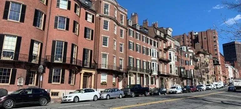 Brick row houses and parked cars on Boston street