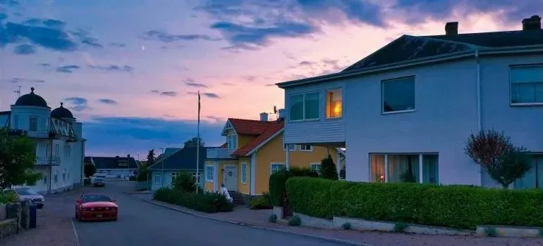 Quiet residential street with houses at dusk