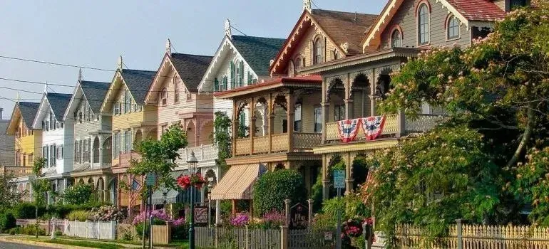 Colorful Victorian houses with gardens, Cape May street