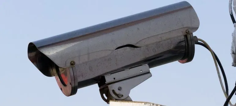 Outdoor security camera against sky