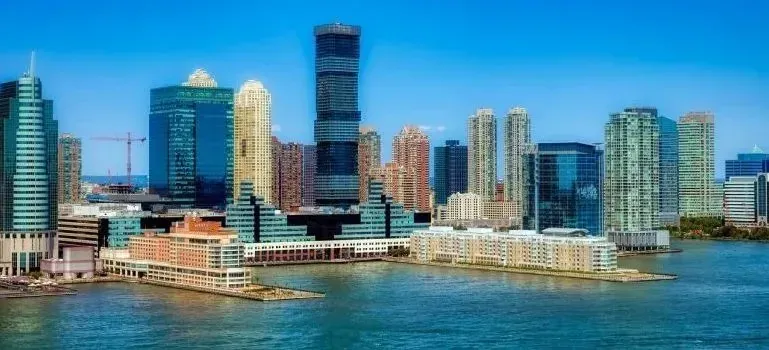 Jersey City waterfront skyline under clear blue sky