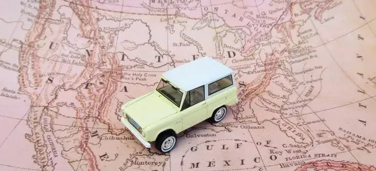 Toy car placed on a vintage United States map