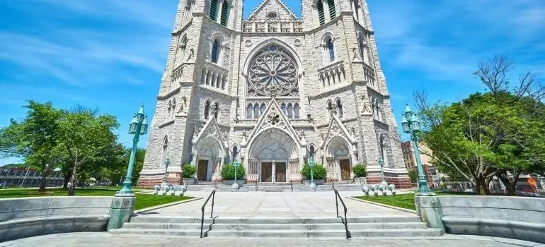 Gothic cathedral facade with twin towers on a sunny day