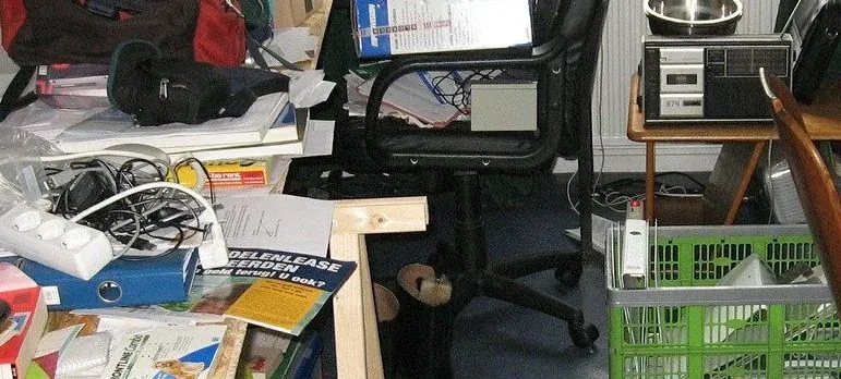 Cluttered room with office chair, junk