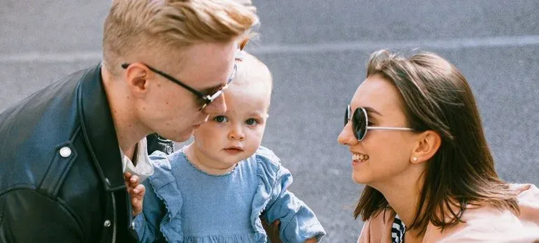 Parents with baby wearing sunglasses
