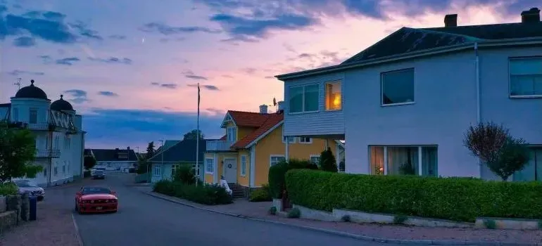 Quiet residential street with houses at dusk