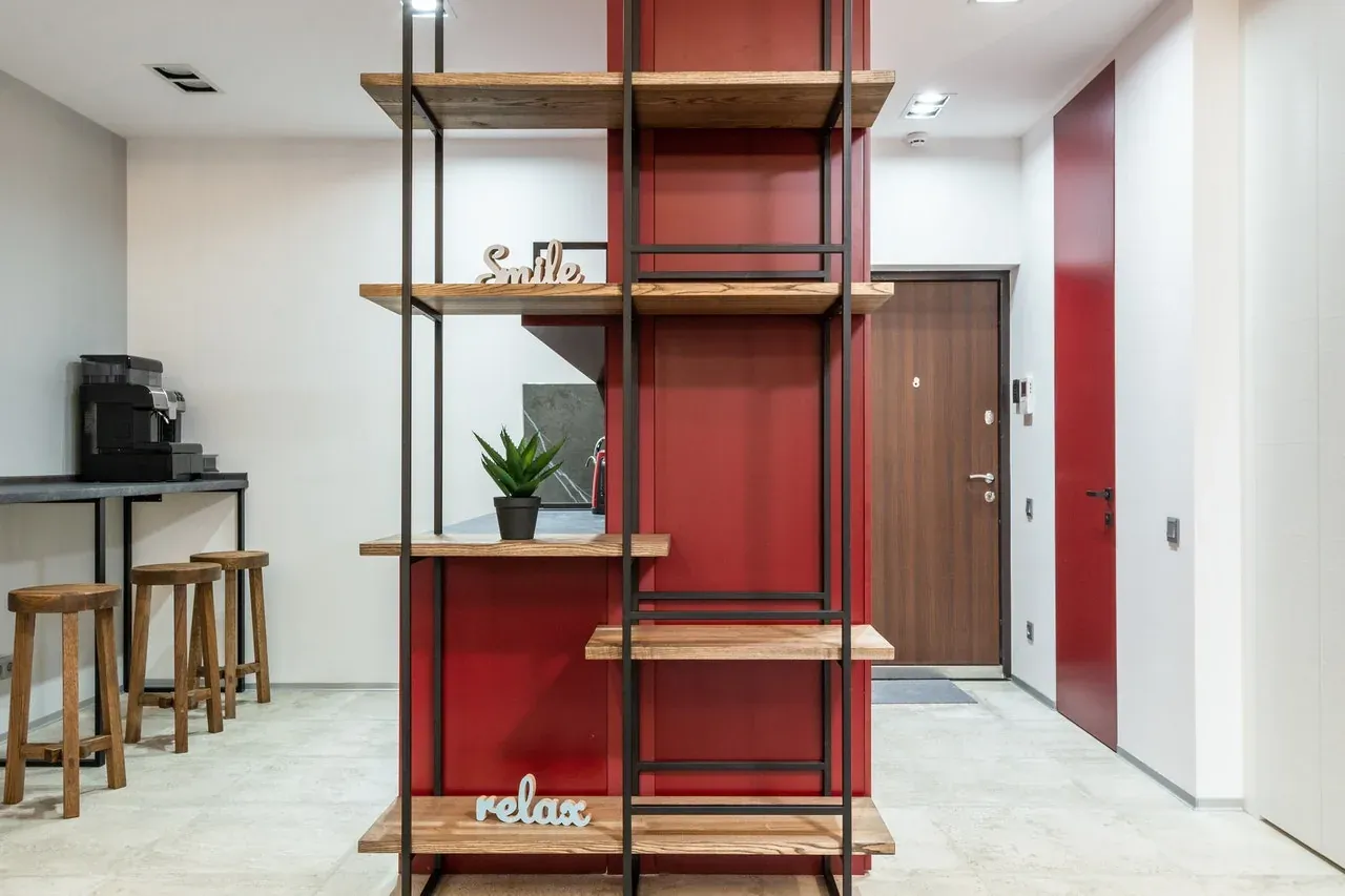 Modern apartment interior with red shelving