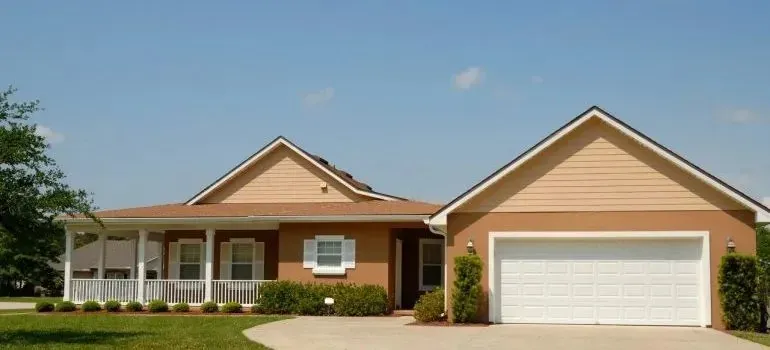 Suburban single-story house with white garage door