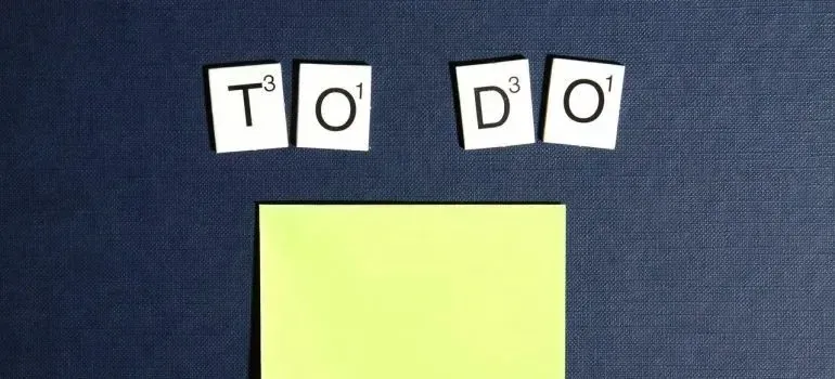 Scrabble tiles spelling TO DO above blank sticky note