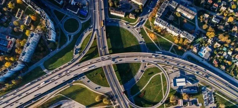 Aerial view of busy highway interchange among greenery