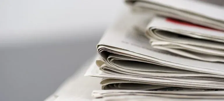 Stack of folded newspapers closeup