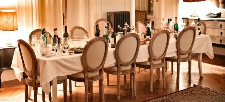 Set dinner table with wine bottles