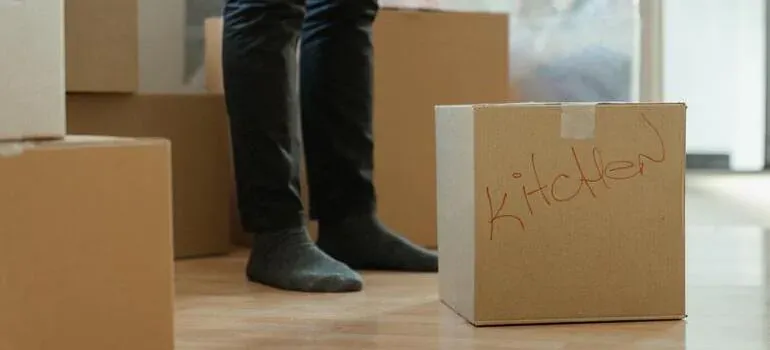 Kitchen-labeled box and person in socks