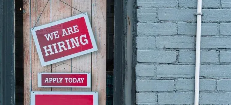 We are hiring signs on storefront