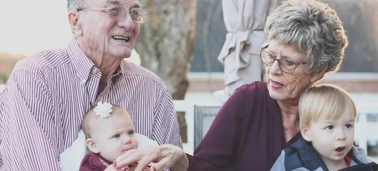 Grandparents with two grandchildren outdoors