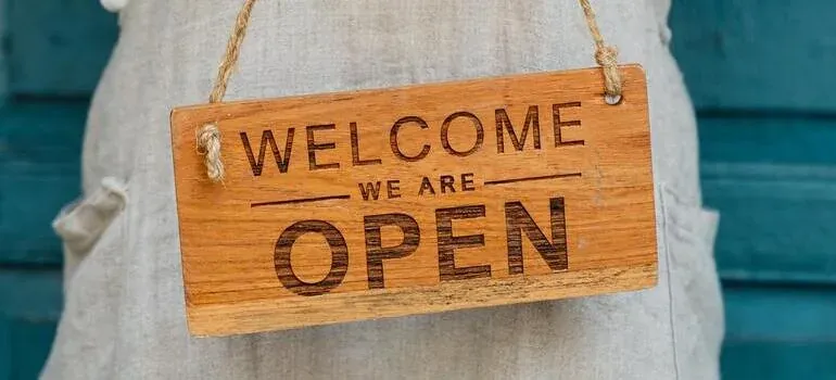 Wooden welcome we are open sign