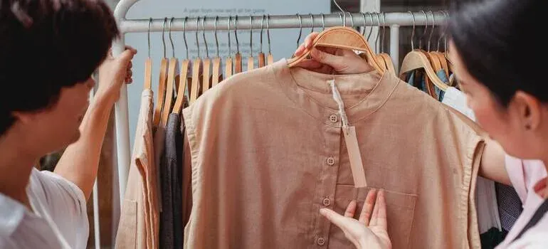 Women browsing clothes on rack