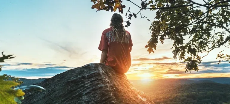 Person on rock at sunset overlook