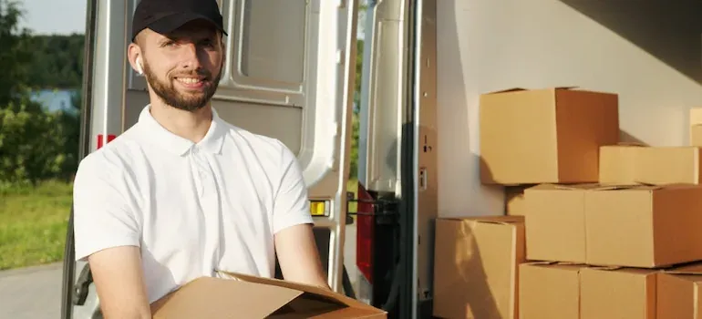 Movers carrying boxes for a medical office relocation in New Jersey