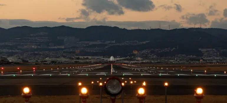 Airplane on runway at dusk