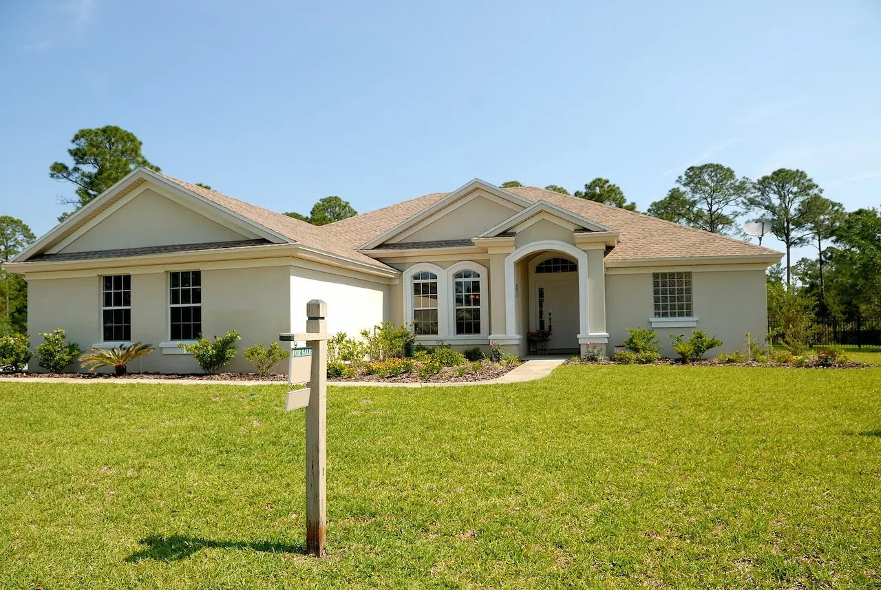 Suburban house with for-sale sign