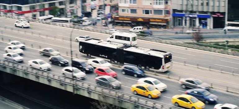 Busy city highway traffic with bus
