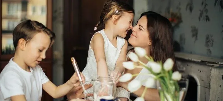 Mother with two children at table