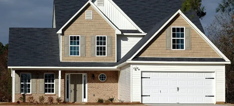 Suburban house with white garage door