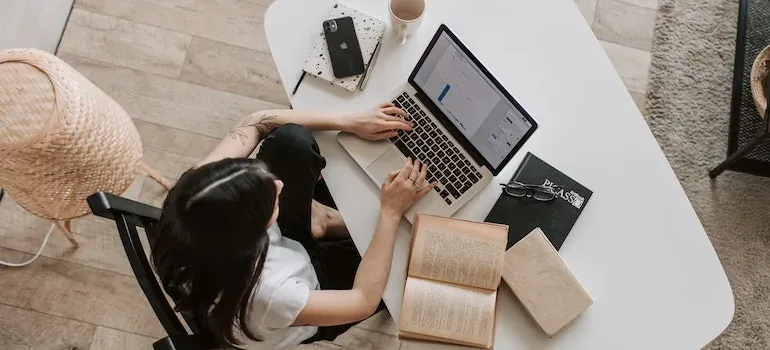 Overhead woman working on laptop