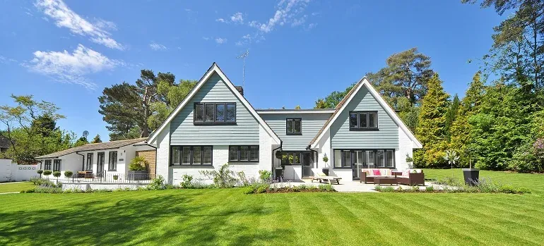 Large white house with green lawn