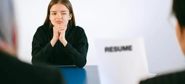 Woman at job interview with resume
