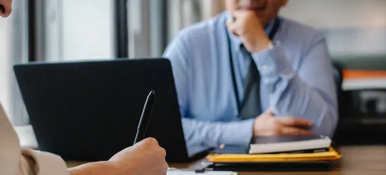Business meeting, laptop and notebooks