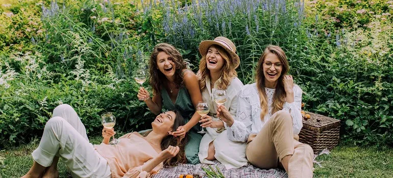 Women laughing at garden picnic