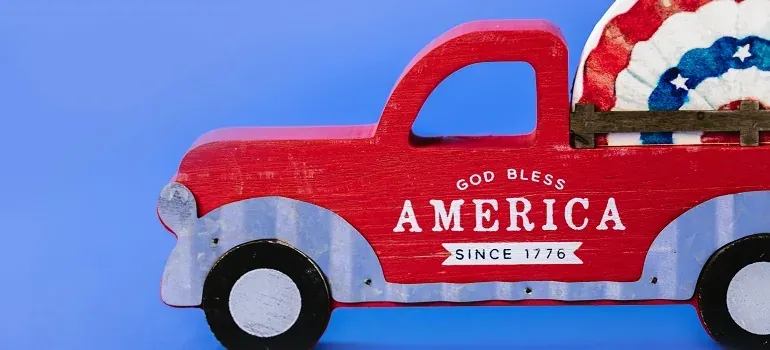 Toy red truck God Bless America