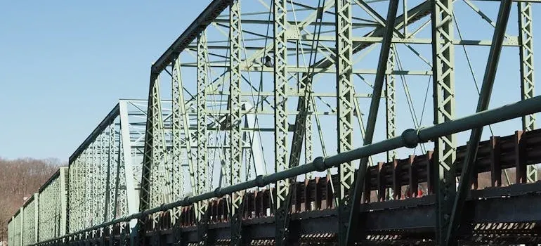 Steel truss bridge against blue sky