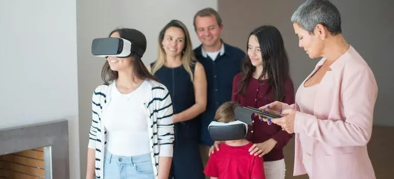 Family trying VR headsets with agent