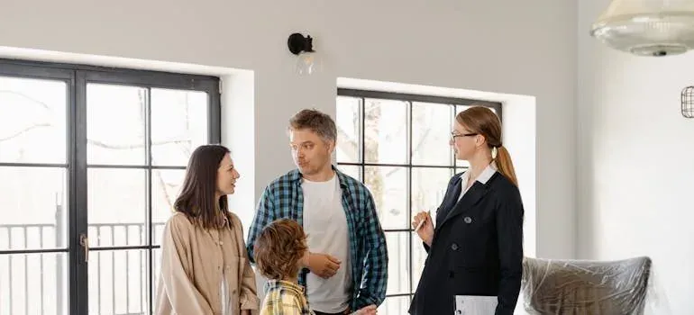 Agent talking with family in apartment