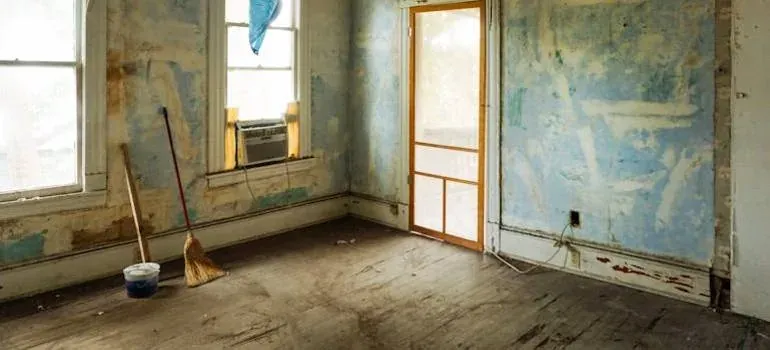 Empty room under renovation, broom