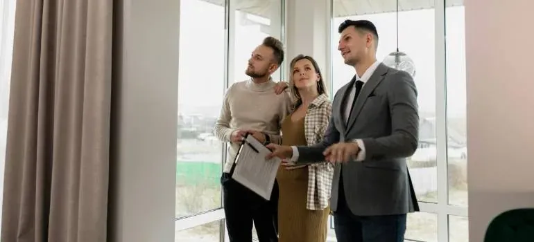 Realtor showing apartment to couple