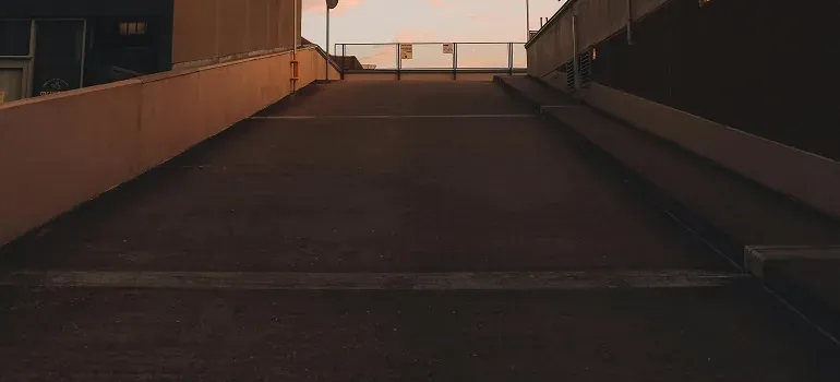 Empty concrete parking ramp at sunset
