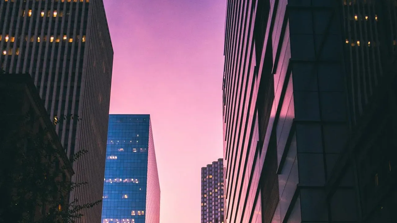 City skyscrapers at purple dusk
